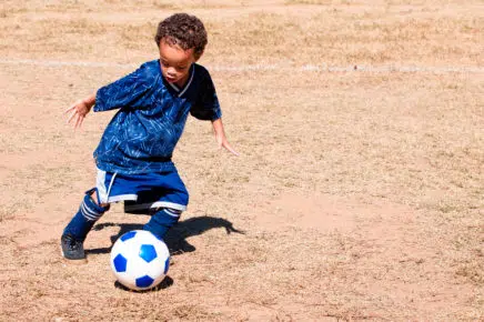 Boy playing soccer