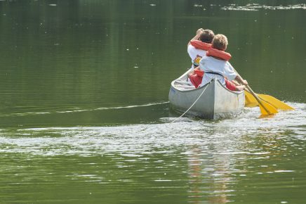 Boys In Summer Camp Paddling Canoe