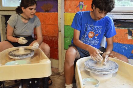 boys creating pottery at summer camp