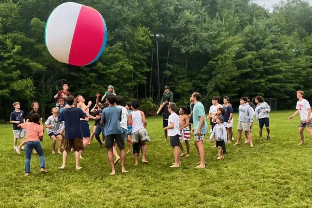 Campers building friendships during group activity at Camp Shohola for Boys, a boys summer camp focused on teamwork and brotherhood