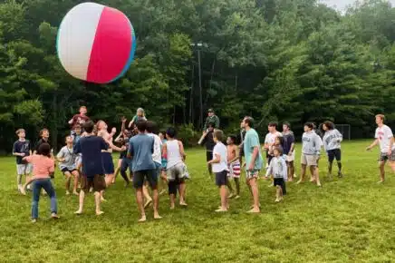 Campers building friendships during group activity at Camp Shohola for Boys, a boys summer camp focused on teamwork and brotherhood
